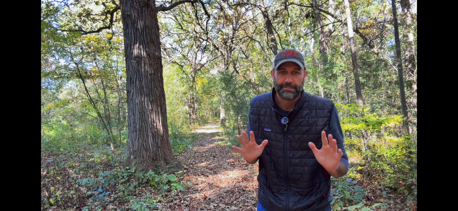 Mike Pope outdoors in a wooded area